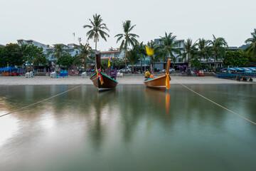 Long exposure image of long tail boats moored at Patong Beach in Phuket