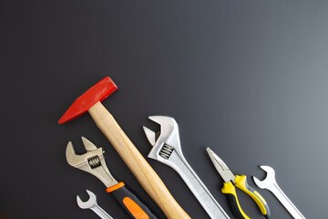 various repair tools on black background