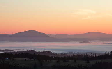 morning landscape with mountains and fog in the valleys