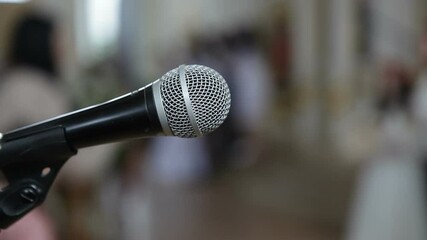 Acoustic microphone on stage in a conference room.