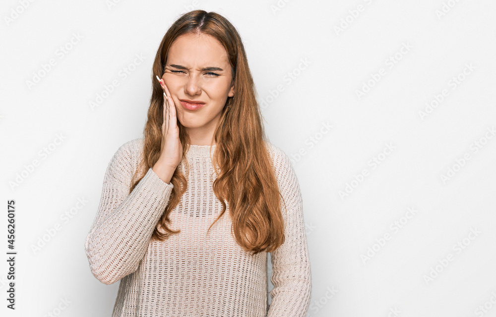 Sticker young blonde woman wearing casual clothes touching mouth with hand with painful expression because o