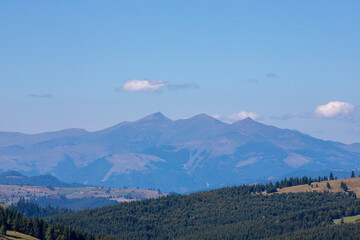 Fototapeta premium Ineu peak in the Rodnei mountains seen through the fog
