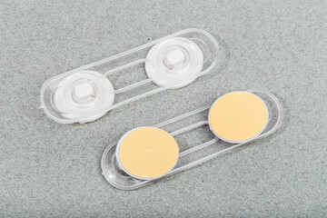 Child safety furniture door lock on gray background .