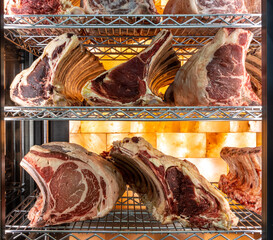 Beef steak in dry aged meat aging cabinet. Barbecue steak on fridge in delicious gourmet...