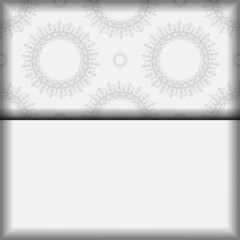 Postcard design White colors with mandala ornament. Vector invitation card with place for your text and vintage patterns.