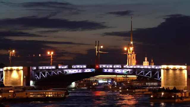 St. Petersburg,Russia -May 31-2021: Timelapse the Divorcing Palace Bridge at night in St. Petersburg and passing ships