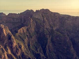 Obraz premium Aerial view of picturesque volcanic mountains at sunrise.