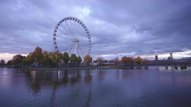 Montreal Observation Wheel or Great Wheel of Montreal  in the evening in fall. (Grande Roue de Montreal) in the Old Port. Ferris wheel on sunset.
