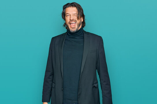Middle age handsome man wearing business clothes winking looking at the camera with sexy expression, cheerful and happy face.