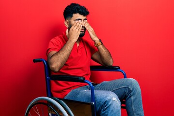 Arab man with beard sitting on wheelchair rubbing eyes for fatigue and headache, sleepy and tired expression. vision problem