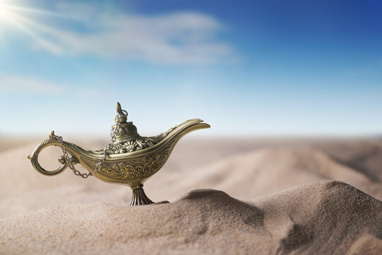 Magical Aladdin oil lamp in desert.