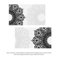 Vector business cards with Greek ornaments. Vector Template for printing design of business cards White color with black vintage ornament.