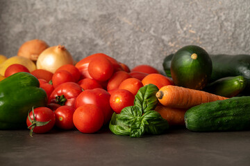 Fototapeta na wymiar fresh vegetables on a gray table