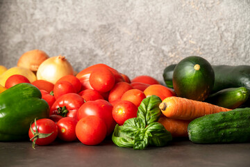 Fototapeta na wymiar fresh vegetables on a gray table