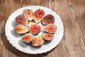 A slice of delicious figs on a plate. Top view.