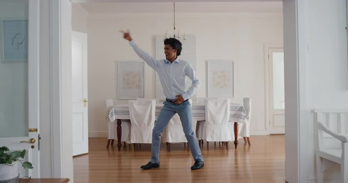 funny man dancing at home celebrating success with weird victory dance moves having fun feeling successful 4k 