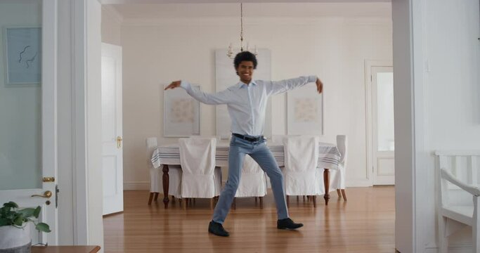 funny man dancing at home celebrating success with weird victory dance moves having fun feeling successful 4k 