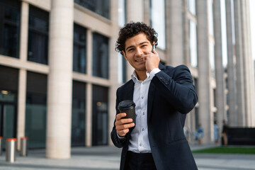 A financier makes a call to a colleague on a mobile phone. A bank employee near the office. An economist goes to work in a business suit. The lawyer responds to clients ' messages by phone.