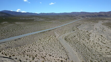 Fototapeta na wymiar route in desert on high plain shot with drone