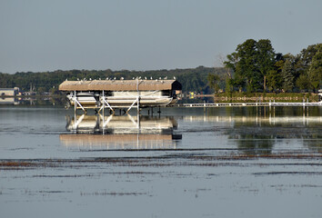 Pontoon boat docked on lake