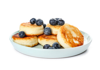 Plate with tasty cottage cheese pancakes and blueberry on white background