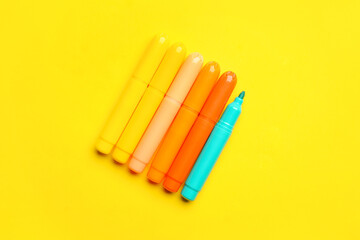 Markers on color background. Concept of uniqueness