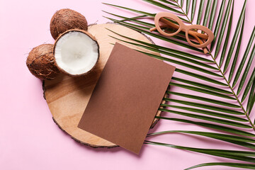 Fototapeta na wymiar Composition with blank card, coconuts, sunglasses and palm leaf on color background