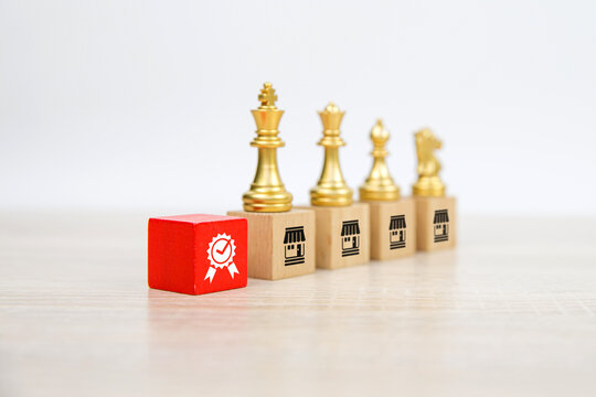 Franchise or franchising, Chess team standing on cube wooden block stack with franchises business store icon for business growth and best quality products or services or branch expansion bank loan.