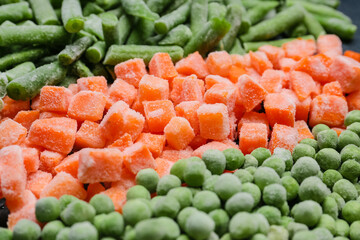 Different frozen vegetables as background, closeup