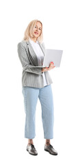 Mature businesswoman with laptop on white background