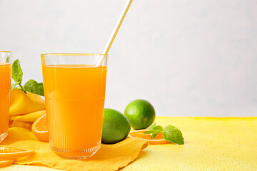 Glass of tasty orange juice on table, closeup