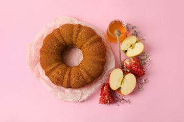 Bread with honey, pomegranate and apple on color background. Rosh hashanah (Jewish New Year) celebration