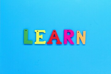 the letters of the alphabet are colored with the word Learn
