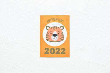 Beautiful greeting card with tiger for year 2022 on white background