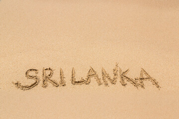 Sri Lanka written in a sandy