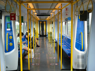 The doors in the trains are closing. while the electric train is running at high speed