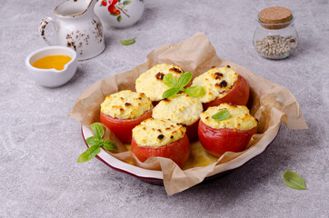 Stewed tomatoes stuffed with cheese