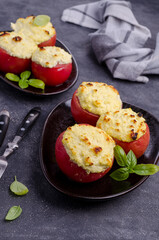 Stewed tomatoes stuffed with cheese