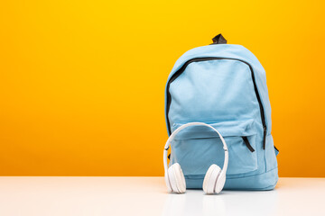 Back to school background. Stationery Supplies in the school bag. Banner design education On Yellow background.