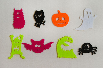 halloween paper creative decoration do it yourself from felt pattern, top view flat lay, festive background, ghost and pumpkin