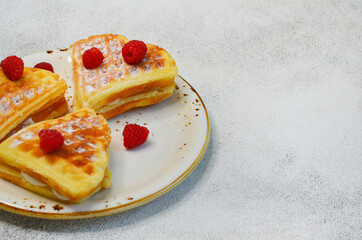 traditional belgian homemade waffles with fresh raspberries, sweet delicious dessert, breakfast idea, food for the Valentine's day holiday