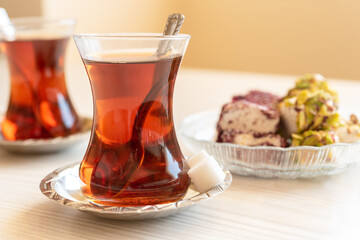 Turkish tea in a traditional glass on the table close-up