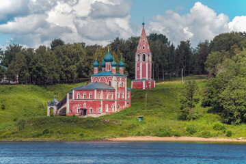View of the ancient church of the Kazan Icon of the Mother of God and the Savior of the Transfiguration (Red Church) from the Volga River on a July afternoon. Tutaev, Russia