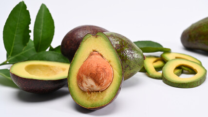 Whole and half avocado isolated on white background. Close up.
