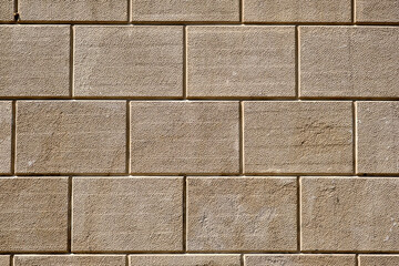 Background from a wall with rectangular brown stone slabs