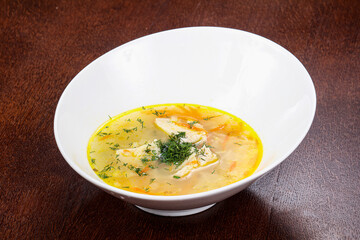 Chicken soup with vegetables and herbs