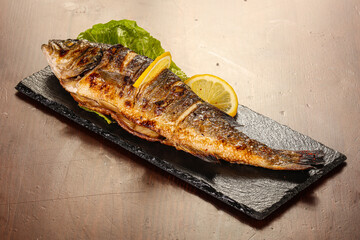Grilled seabass servel lemon slice