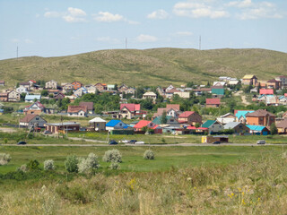 Obraz premium One of the districts of the city of Ust-Kamenogorsk (kazakhstan). City outskirts. Cottages. Summer steppe