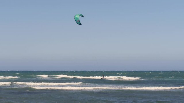 Kitesurfing During a Windy Day with a Very Rough Sea - slow motion