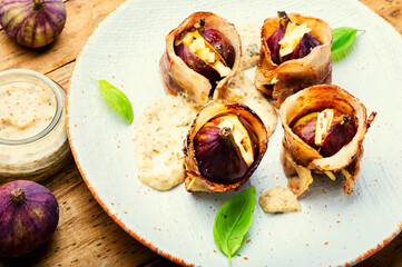 Figs roasted in bacon with cheese